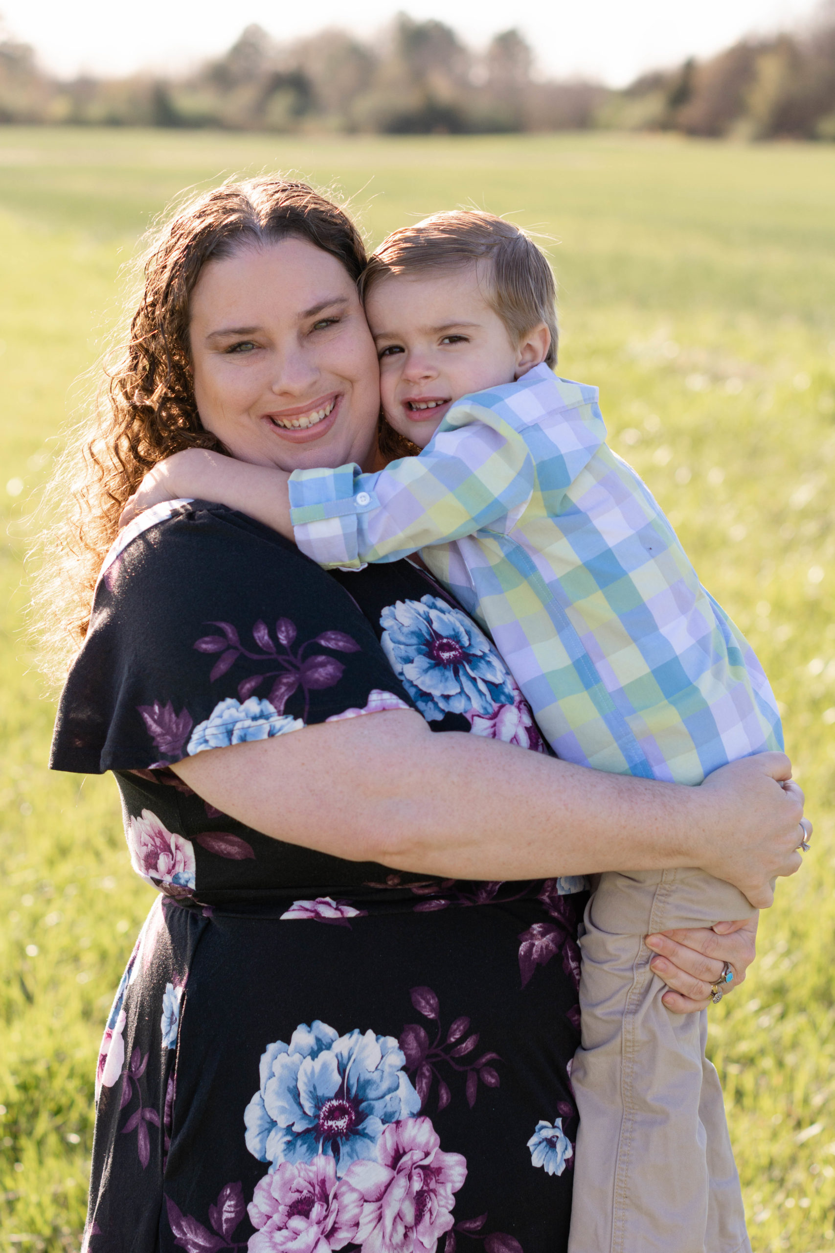 Mom and son posing during their spring mini session
